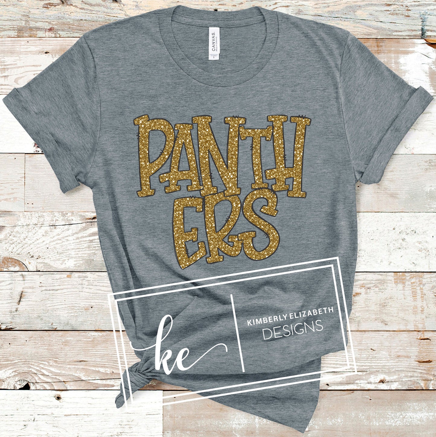 UC0242 gold glitter black outline grey shirt